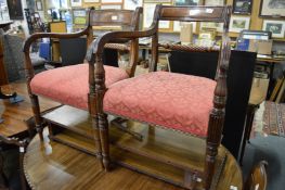 A matched set of six early 19th century mahogany dining chairs, two with arms.