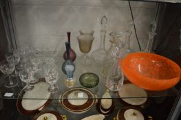 Glassware to include large orange decorative glass bowl, decanters etc.