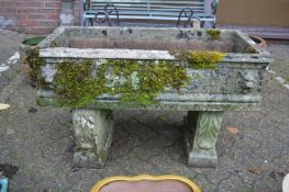 A good reconstituted stone trough on column supports.