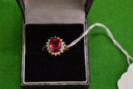 A 9ct gold and gem set dress ring.