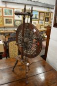 A 19th century spinning wheel.