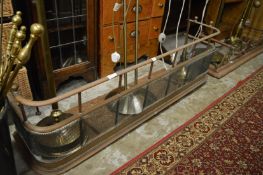 Two fenders and various fireside tools.