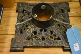 A cast iron Christmas tree stand.