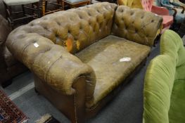 A leather Chesterfield style drop-in two seater settee (for upholstery).