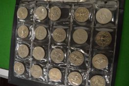 A folder containing a good collection of crowns, three penny bits etc.