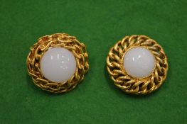 A pair of designer ear clips.