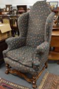 A good large pair of high back wing armchairs.