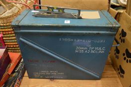 A military tin trunk and two old spirit levels.