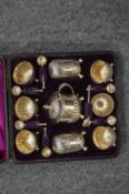 A cased silver cruet set.