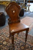 A 19th century mahogany hall chair.