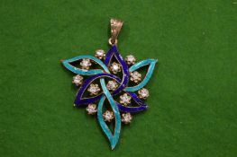 A decorative silver and enamel pendant.