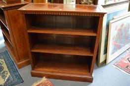 A pair of Chinese red wood open bookcases.