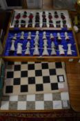 Boxed chest set and chess boards.