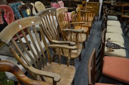 Three Windsor armchairs and a pair of similar stick back chairs.
