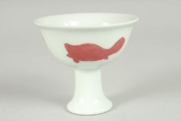 A CHINESE UNDERGLAZE RED AND WHITE PORCELAIN STEM CUP, 9.5cm diameter.