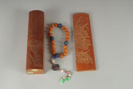 A CHINESE CARVED BAMBOO BOX CONTAINING A BEADED NECKLACE, together with a carved bamboo wrist