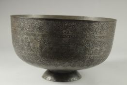 A FINE AND LARGE 19TH CENTURY QAJAR ENGRAVED TINNED COPPER BOWL, with a band of various figures