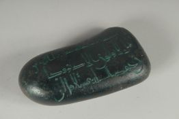 AN ISLAMIC KUFI WRITING STONE.