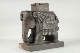 A LARGE CHINESE CARVED HARDWOOD ELEPHANT STAND, on a rectangular base measuring 40cm x 22cm, 43.