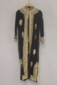 A MIDDLE EASTERN GILT THREAD EMBROIDERED HOUSE COAT.