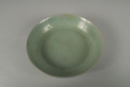 A CHINESE RU WARE SAUCER DISH, 14cm diameter.