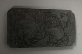 A CHINESE SCROLL WEIGHT.