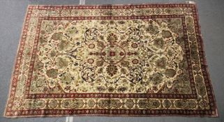 A LARGE PERSIAN KASHAN RUG. 305cm x 199cm.