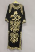 A MIDDLE EASTERN GILT THREAD EMBROIDERED HOUSE COAT.