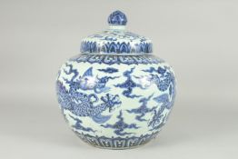 A LARGE CHINESE BLUE AND WHITE PORCELAIN DRAGON JAR, 38cm high.