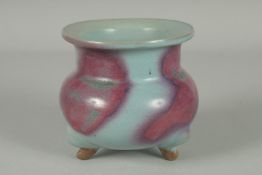 A CHINESE JUN WARE PORCELAIN TRIPOD CENSER, 10cm high.