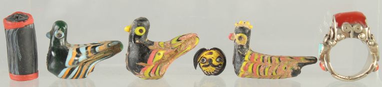 FOUR ISLAMIC GLASS PIECES, together with a ring and a cylindrical bead, (6).