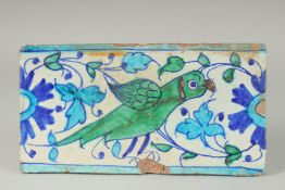 A FINE 18-19TH CENTURY MUGHAL NORTH INDIAN MULTAN TILE WITH PARROT DESIGN, 29cm x 15.5cm.
