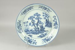A LARGE CHINESE BLUE AND WHITE PORCELAIN CHARGER, decorated with a central floral panel, 44.5cm