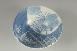 A CONTEMPORARY JAPANESE BLUE AND WHITE PORCELAIN BOWL, 15cm diameter.