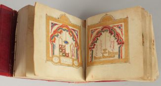 A 19TH CENTURY MOROCCAN LEATHER BOUND DALA'IL AL KHAYRAT, with images of Mecca and Madina with