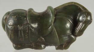 A GREEN HARDSTONE FIGURE OF A HORSE, 7cm long.