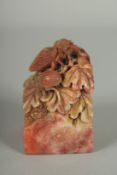 A GOOD CHINESE CARVED SOAPSTONE SEAL, carved with insects on a foliate base, together with fitted