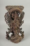 A FINE BALINESE CARVED WOOD FIGURE OF VISHNU RIDING GARUDA, 31cm high.