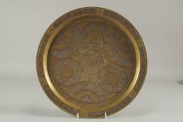 A CAIROWARE SILVER AND COPPER INLAID BRASS TRAY, 34cm diameter.