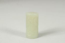 A CHINESE CARVED JADE CYLINDRICAL BEAD, 3.5cm long.