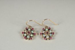 A PAIR OF 9CT GOLD RUBY AND OPAL EARRINGS.