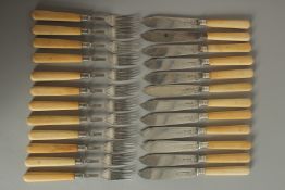 A SET OF TWELVE BONE HANDLED FISH KNIVES AND FORKS. Sheffield 1909.