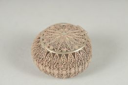 A WHITE METAL FILLIGREE CIRCULAR BOX with hinged lid.