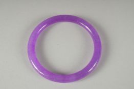 A LAVENDER JADE BANGLE. 7cm diameter.