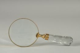 A MAGNIFYING GLASS with cut glass handle.