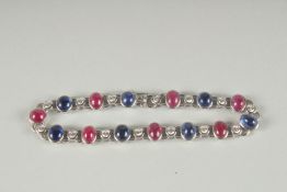 A VERY GOOD 18CT WHITE GOLD RUBY, SAPPHIRE AND DIAMOND LINE BRACELET.
