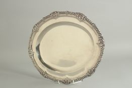 A LARGE VICTORIAN OVAL SILVER MEAT DISH by ROBERT GARRARD with a gadrooned edge and shell border.
