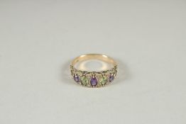 A 9CT GOLD SUFFRAGETTE'S RING, AMETHYST, PERIDOT AND DIAMOND RING.
