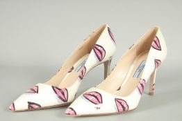 A PAIR OF PRADA WHITE LEATHER SHOES WITH LIP DECORATION, UNUSED, appear as new in box. size UK 36.5