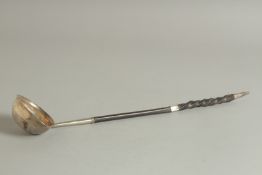 A GEORGE III SILVER TODDY LADLE. 14.5ins long, faint mark.
